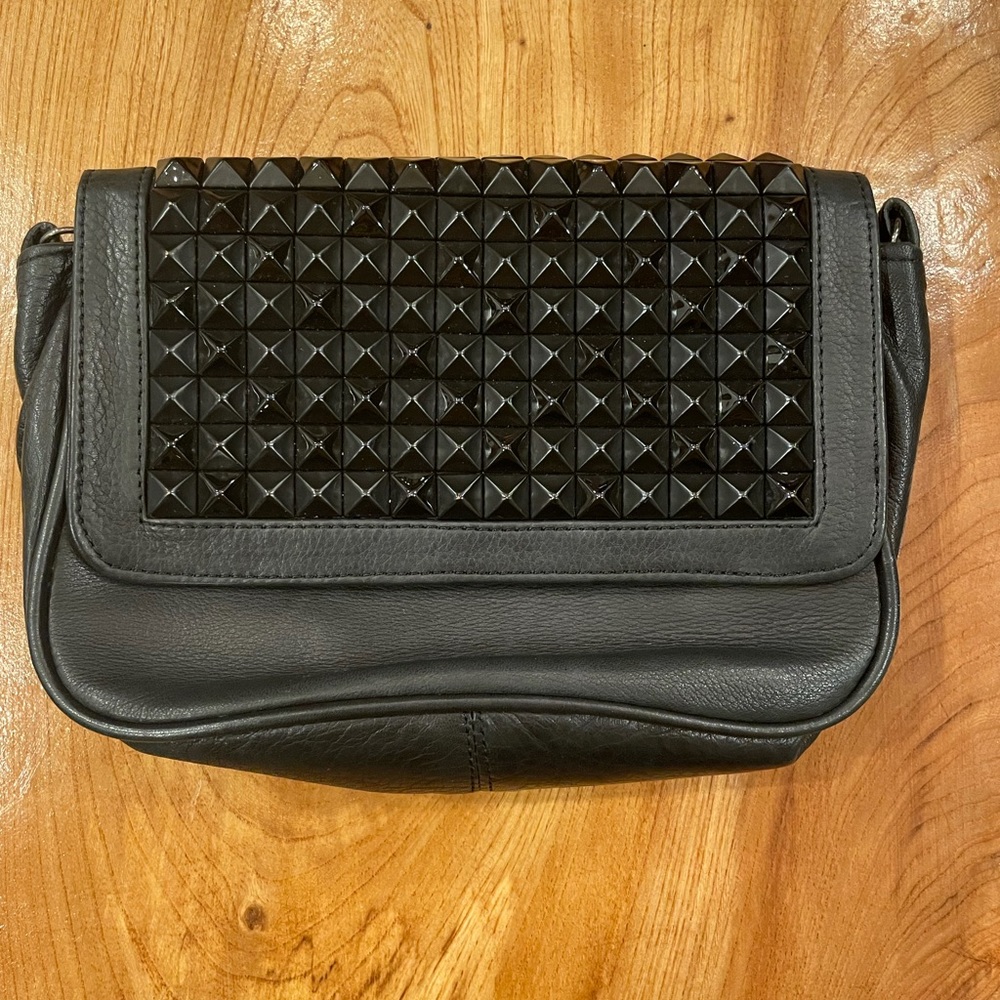 Studded leather Cassandra LA clutch.